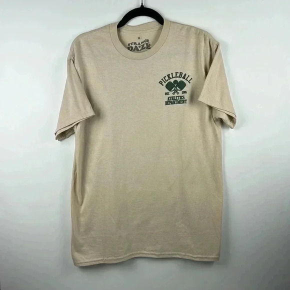 PICKLEBALL TEE SHIRT SZ M 100%COTTON STRANGE DAZE BEIGE /GREEN GRAPHICS SHORT SL - Picture 1 of 5